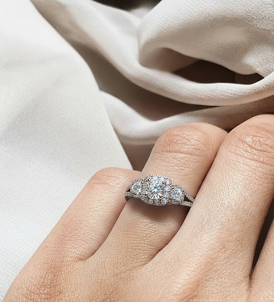 High jewelry round cut three stone halo ring on reflective background