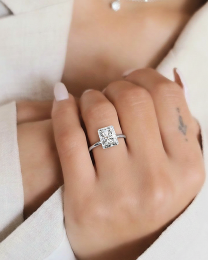 Hand wearing radiant cut lab grown diamond solitaire ring