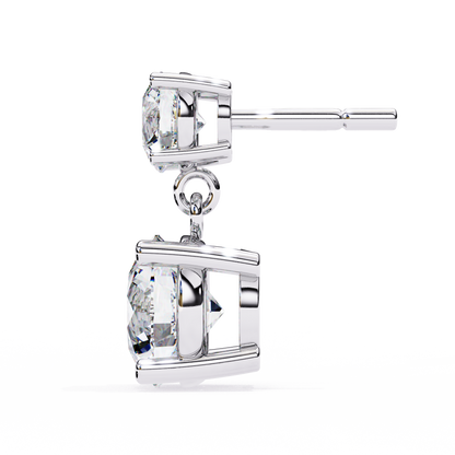 Tilted side angle of round lab grown diamond drop earrings in white gold