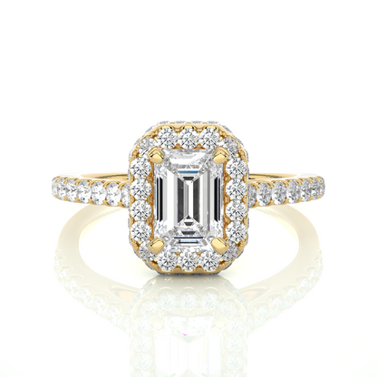 Yellow gold engagement ring with emerald cut center diamond