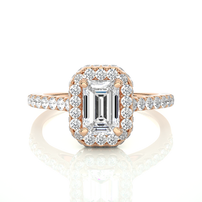 Close up of emerald cut diamond halo ring with pavé band