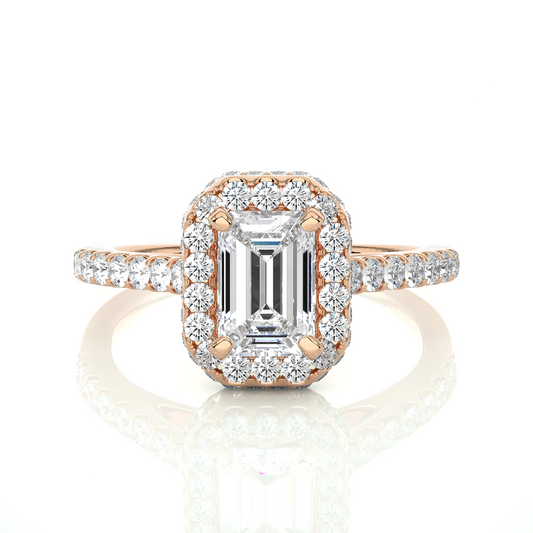 Close up of emerald cut diamond halo ring with pavé band