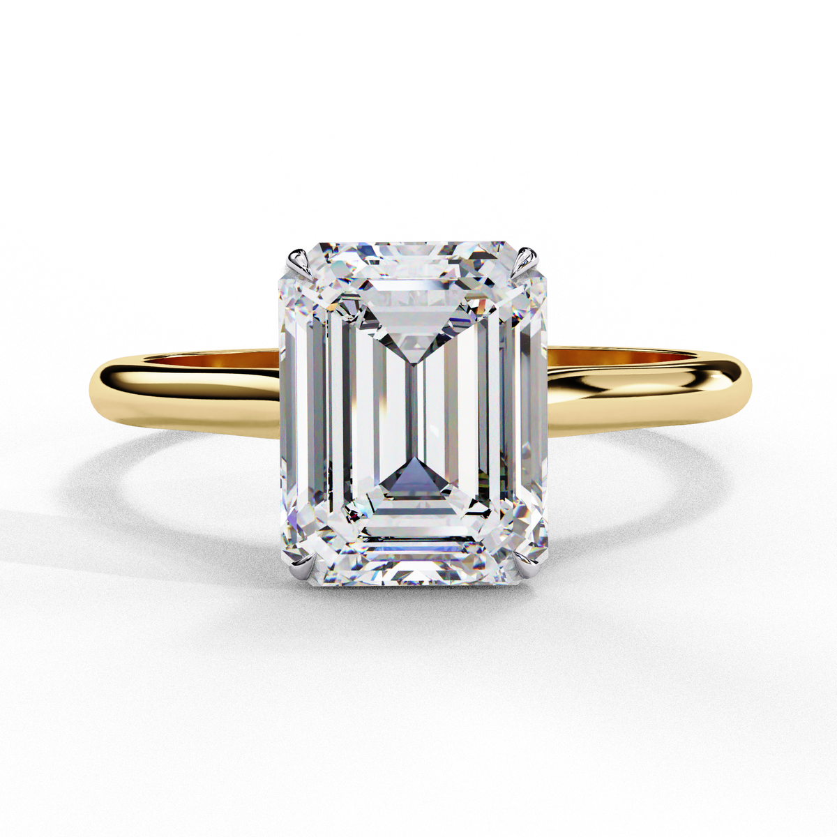 Yellow gold emerald cut diamond engagement ring with four prong setting