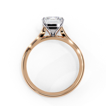 Side profile of emerald cut lab diamond solitaire ring with raised prongs