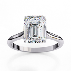 Hand wearing emerald cut solitaire lab grown diamond ring