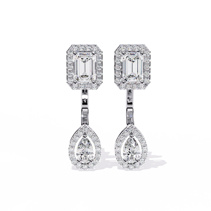 White gold halo drop earrings with emerald top and pear bottom worn look