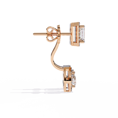 Close up of emerald cut and pear shape lab diamond halo earrings