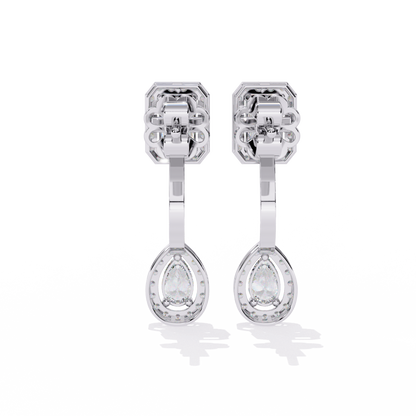 Angled view of emerald and pear diamond drop earrings with halo setting