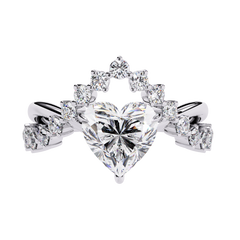 Front view of heart cut diamond ring with round accent stones in white gold
