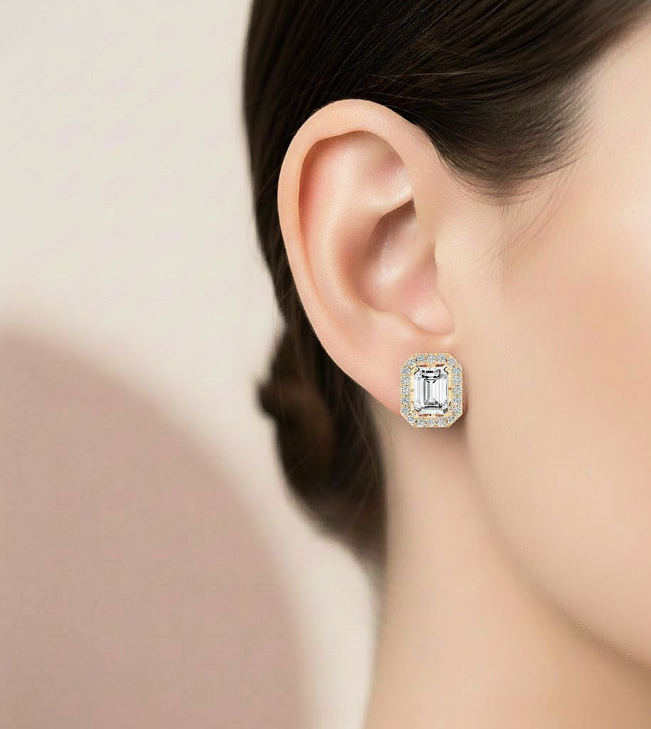 Emerald shape diamond stud earrings with round accent stones