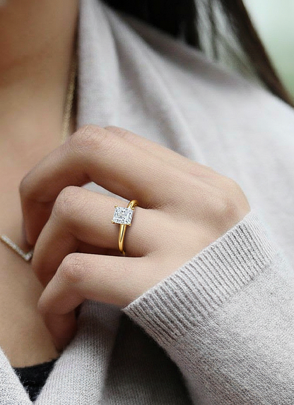 Hand wearing princess shape solitaire ring for women