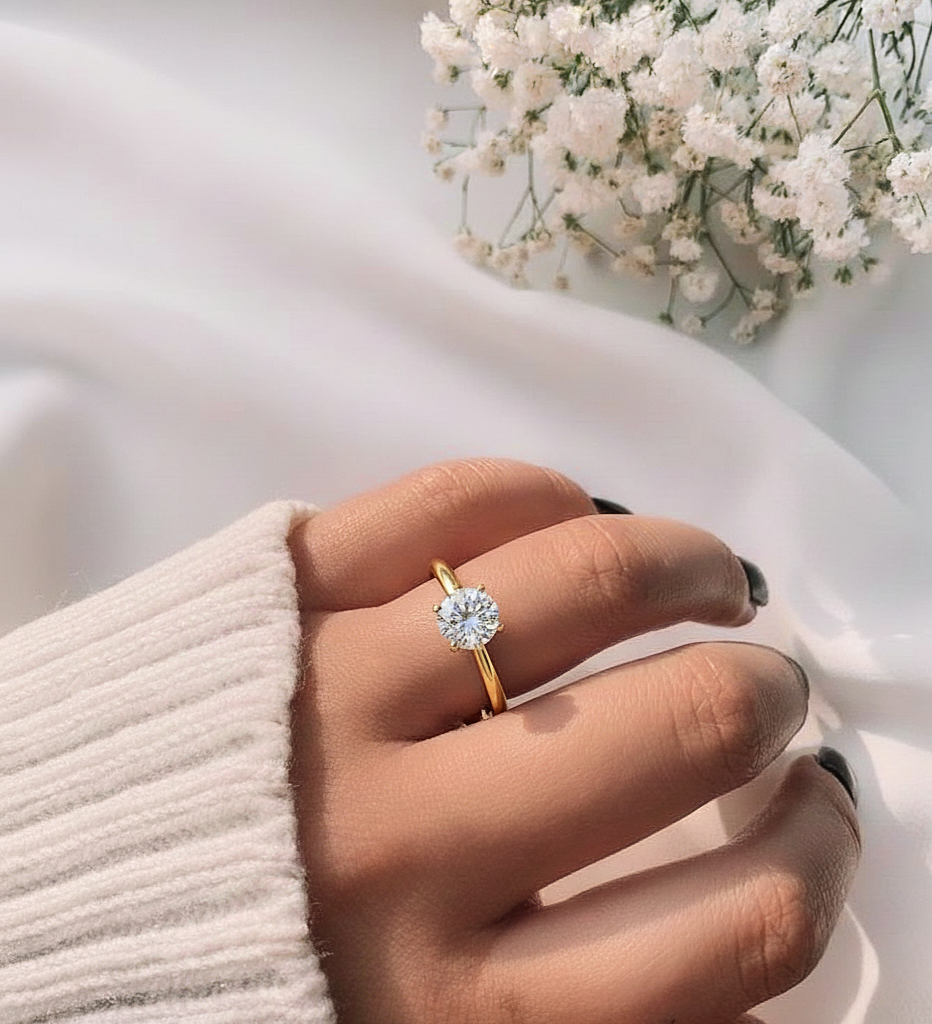 Angled view of round cut diamond engagement ring with polished finish