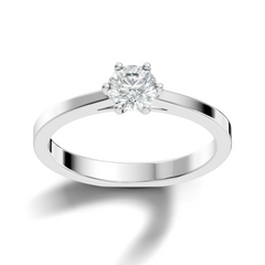 Close up of round cut solitaire ring with refined setting details