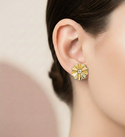 Floral diamond stud earrings worn on ear with white gold finish