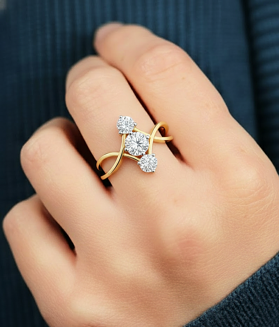 Close-up shot of round lab diamond engagement ring with triple stone setting, worn look
