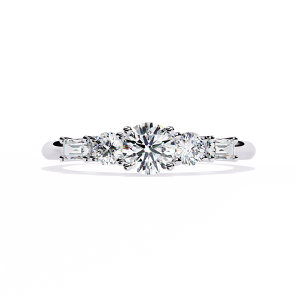 White gold ring with round center diamond and tapered baguette accents