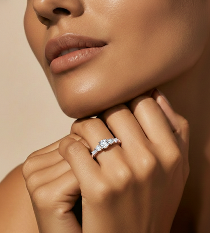 Round brilliant center stone ring with baguette diamond shoulders