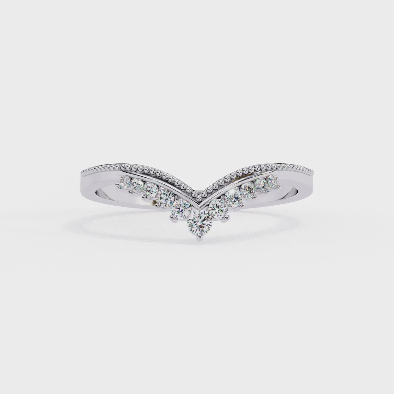 360 view video of V shaped lab diamond cluster band rotating on white background