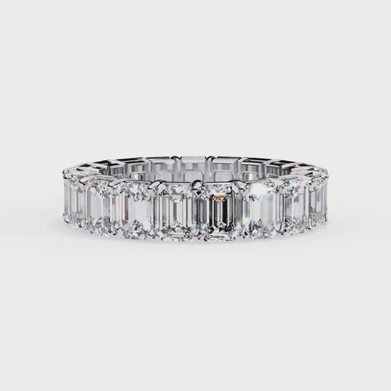 Modern eternity band ring with emerald cut stones