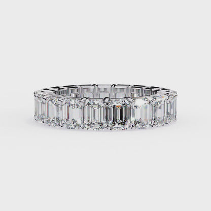 Modern eternity band ring with emerald cut stones